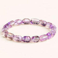 Plum Facets — Super Seven Quartz Barrel Bracelet, product detail on warm ivory