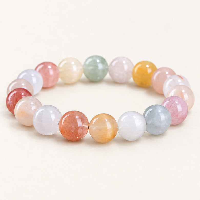 Rainbow Veil — Fiber-Inclusion Quartz Bead Bracelet on a warm ivory studio background