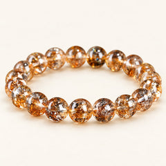 Golden Koi — Included Quartz Bead Bracelet on a warm ivory studio background