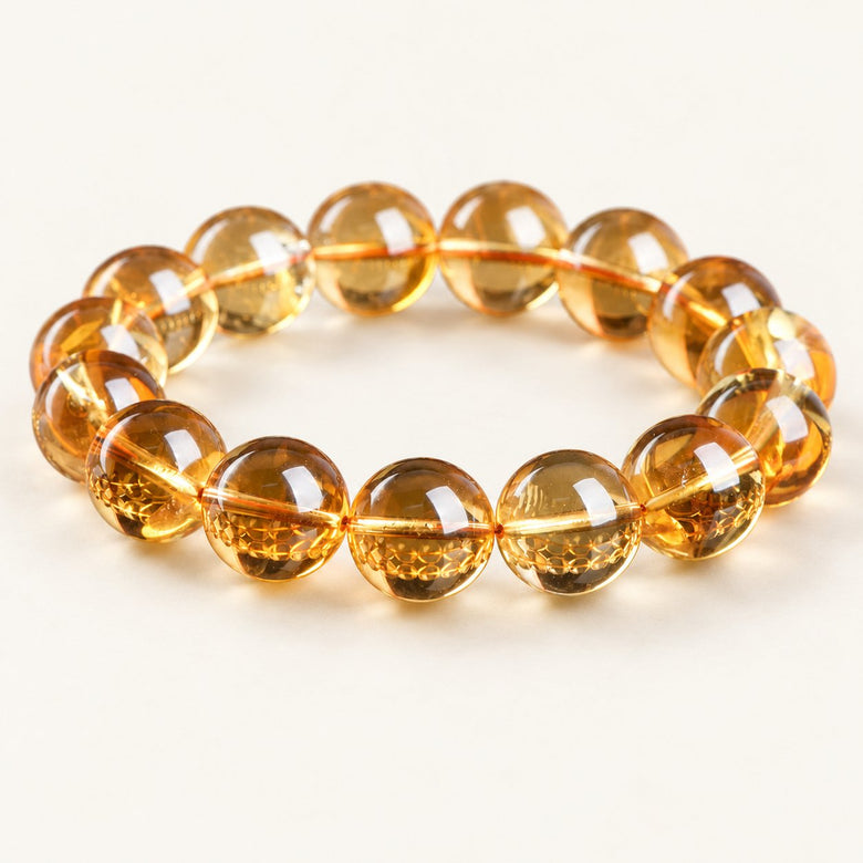 Golden Radiance — Citrine Bead Bracelet on a warm ivory studio background