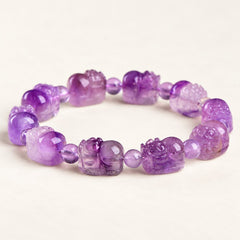 Violet Guardian — Super Seven Quartz Pixiu Bead on a warm ivory studio background