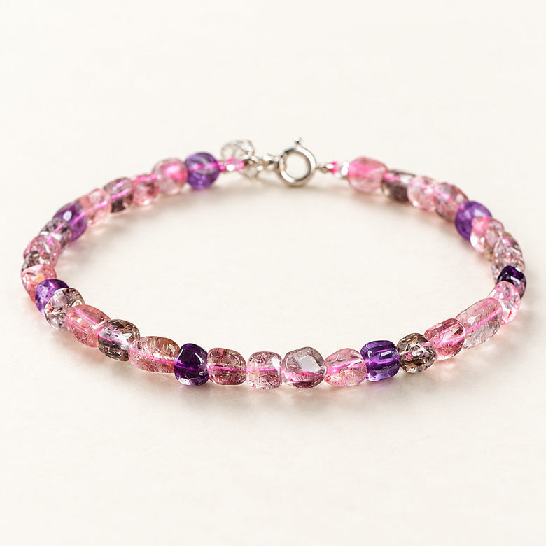 Aurora Drift — Freeform Super Seven Quartz Bracelet on a warm ivory studio background