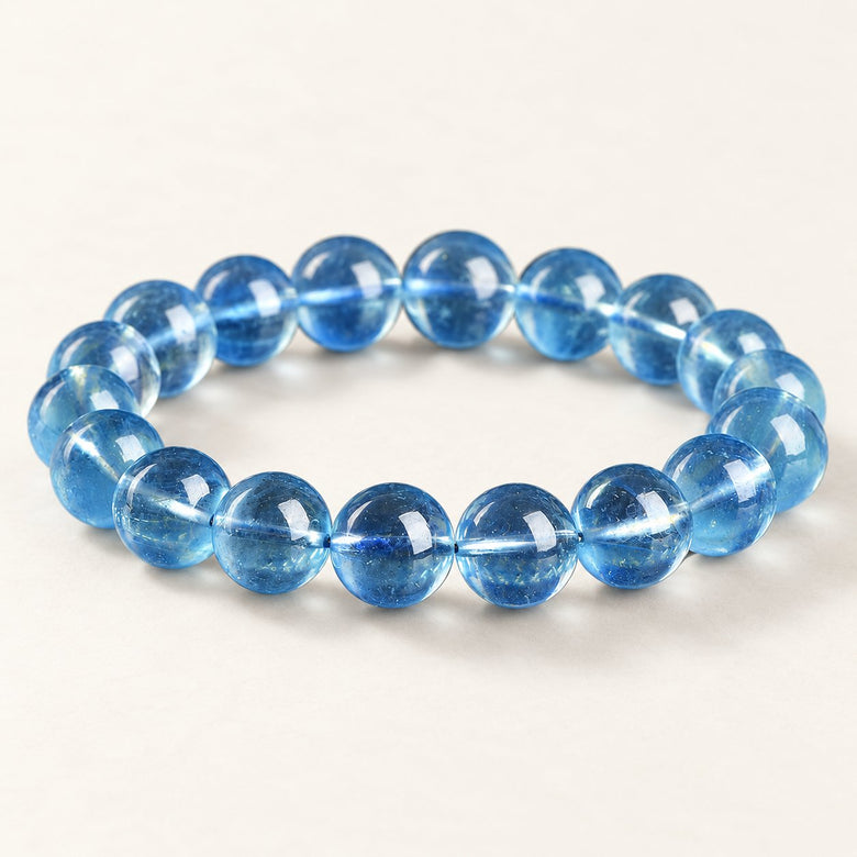 Sea Glass — Aquamarine Round Beads on a warm ivory background