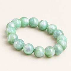 Emerald Meadow — Green Mica Bead Bracelet, product detail on warm ivory