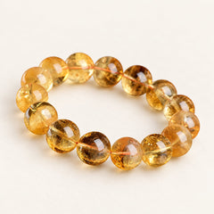 Amber Light — Deep Yellow Citrine Bead Bracelet, product detail on warm ivory