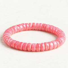 Rose Reverie — Rhodochrosite Disc Bead Bracelet on a warm ivory studio background