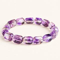 Plum Facets — Super Seven Quartz Barrel Bracelet, product detail on warm ivory