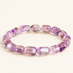Plum Facets — Super Seven Quartz Barrel Bracelet, product detail on warm ivory