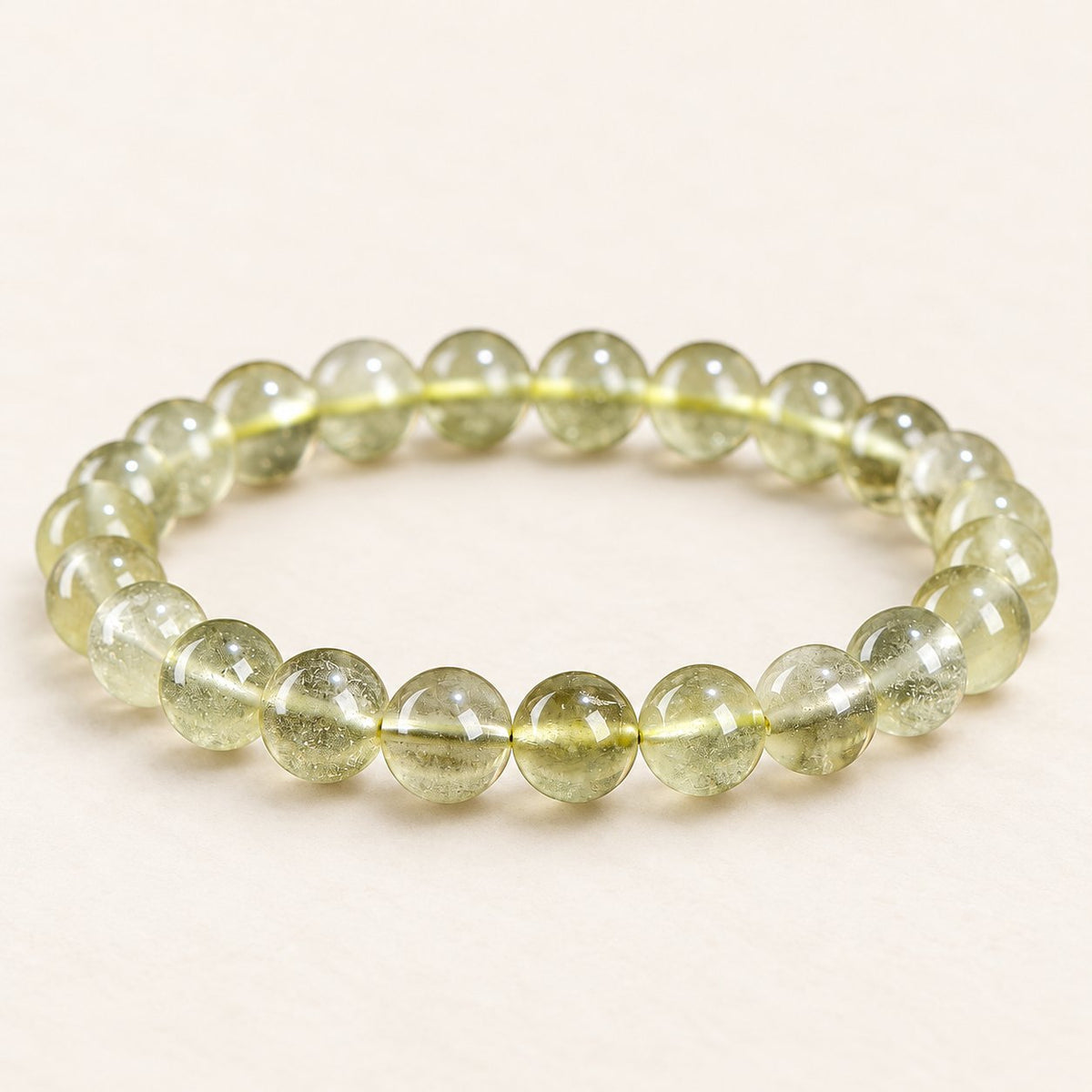 Desert Gold — Golden Glass Bead Bracelet, product detail on warm ivory
