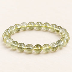 Desert Gold — Golden Glass Bead Bracelet, product detail on warm ivory